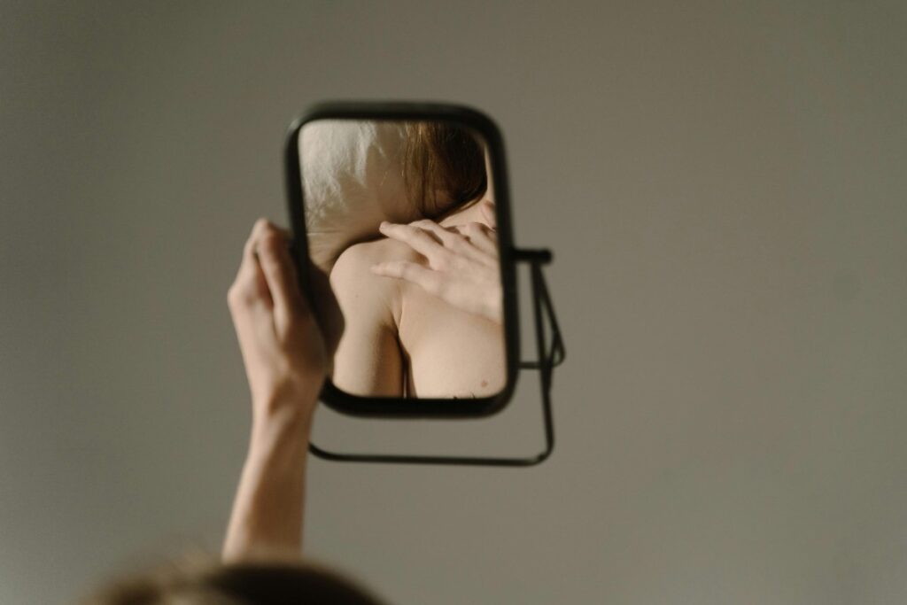 mirror image of woman